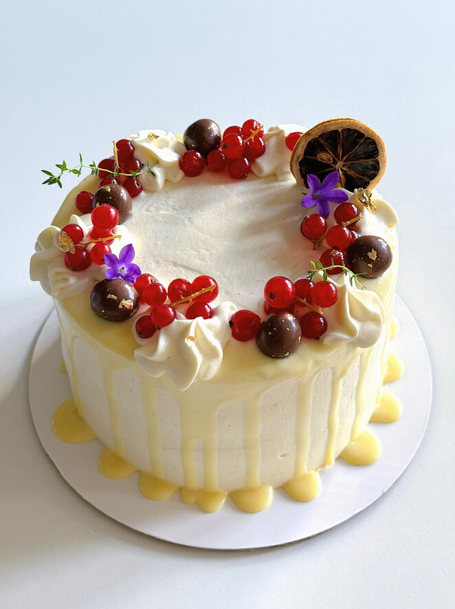 white chocolate drizzle fruit themed anniversary cake