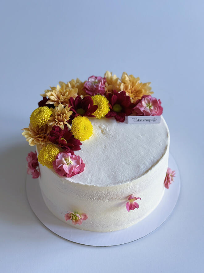 Naked vanilla cake with flowers