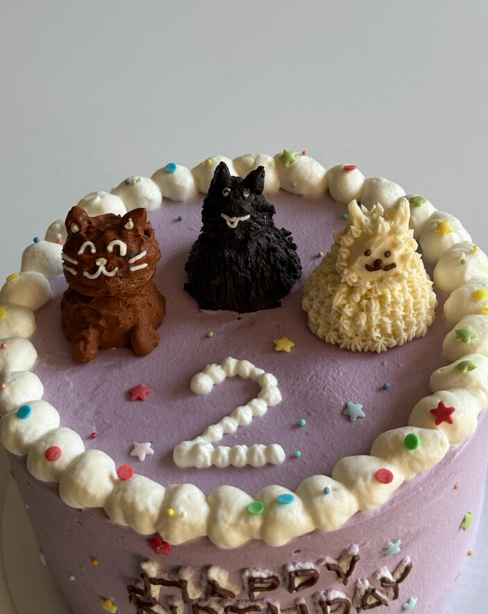 birthday cake for 2 year old with custom butter cream animals buttercream cat, dog, llama